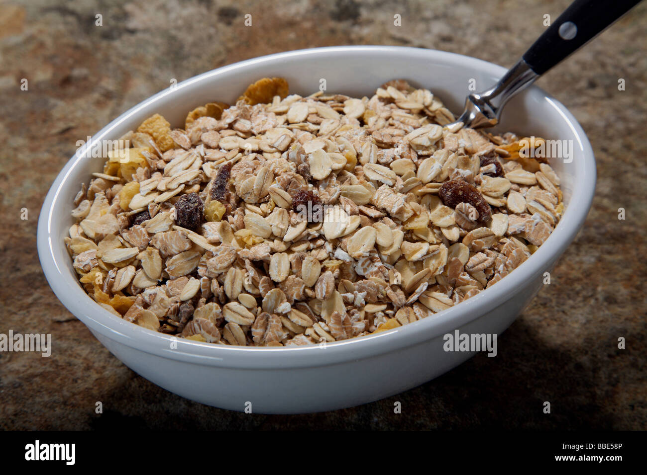Muesli bowl with spoon Stock Photo