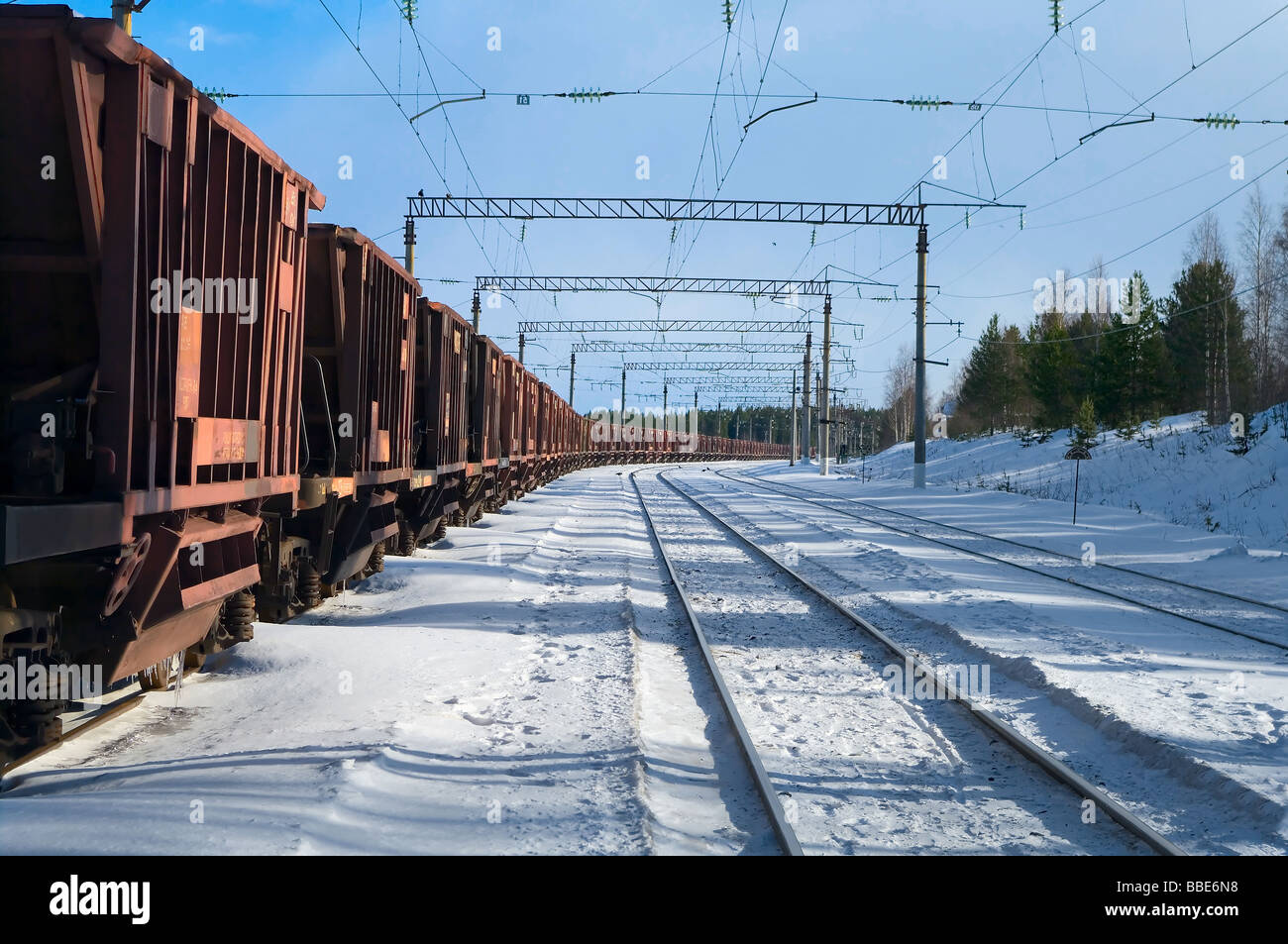 Freight train with wagons going to the distant Stock Photo