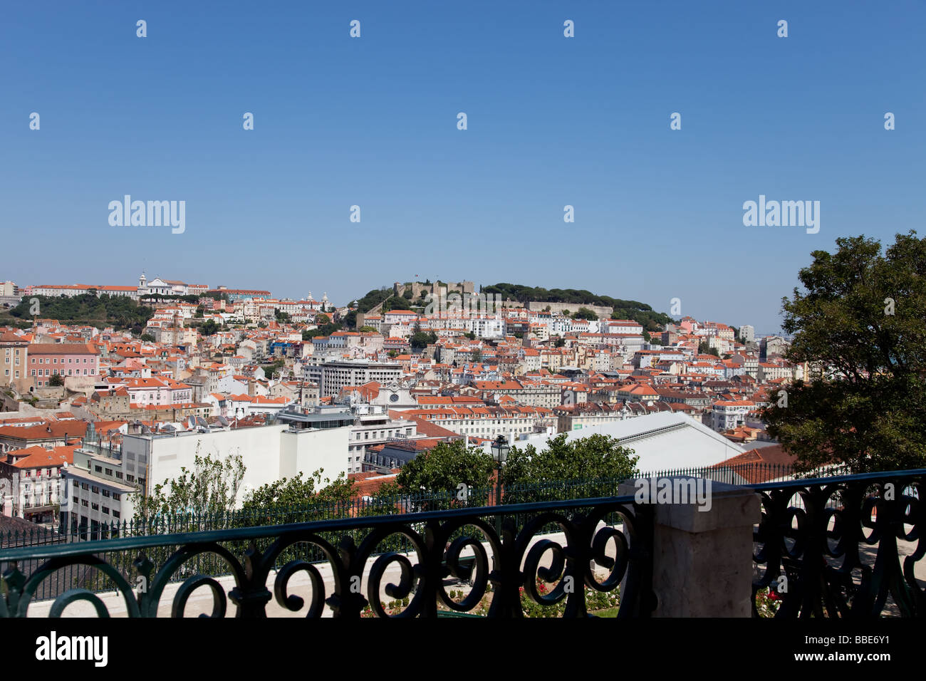 View of the Baixa (Lisbon downtown) and the Sao Jorge Castle from the Miradouro de Sao Pedro de Alcantara (Belvedere). Stock Photo
