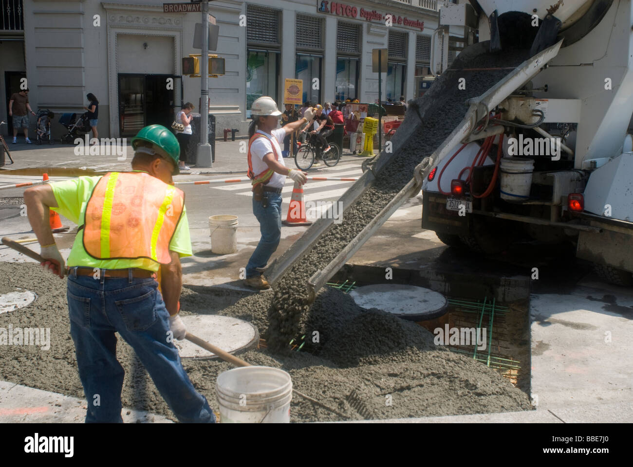Contractors for the New York City Dept of Transportation pour cement in Union Square Stock Photo