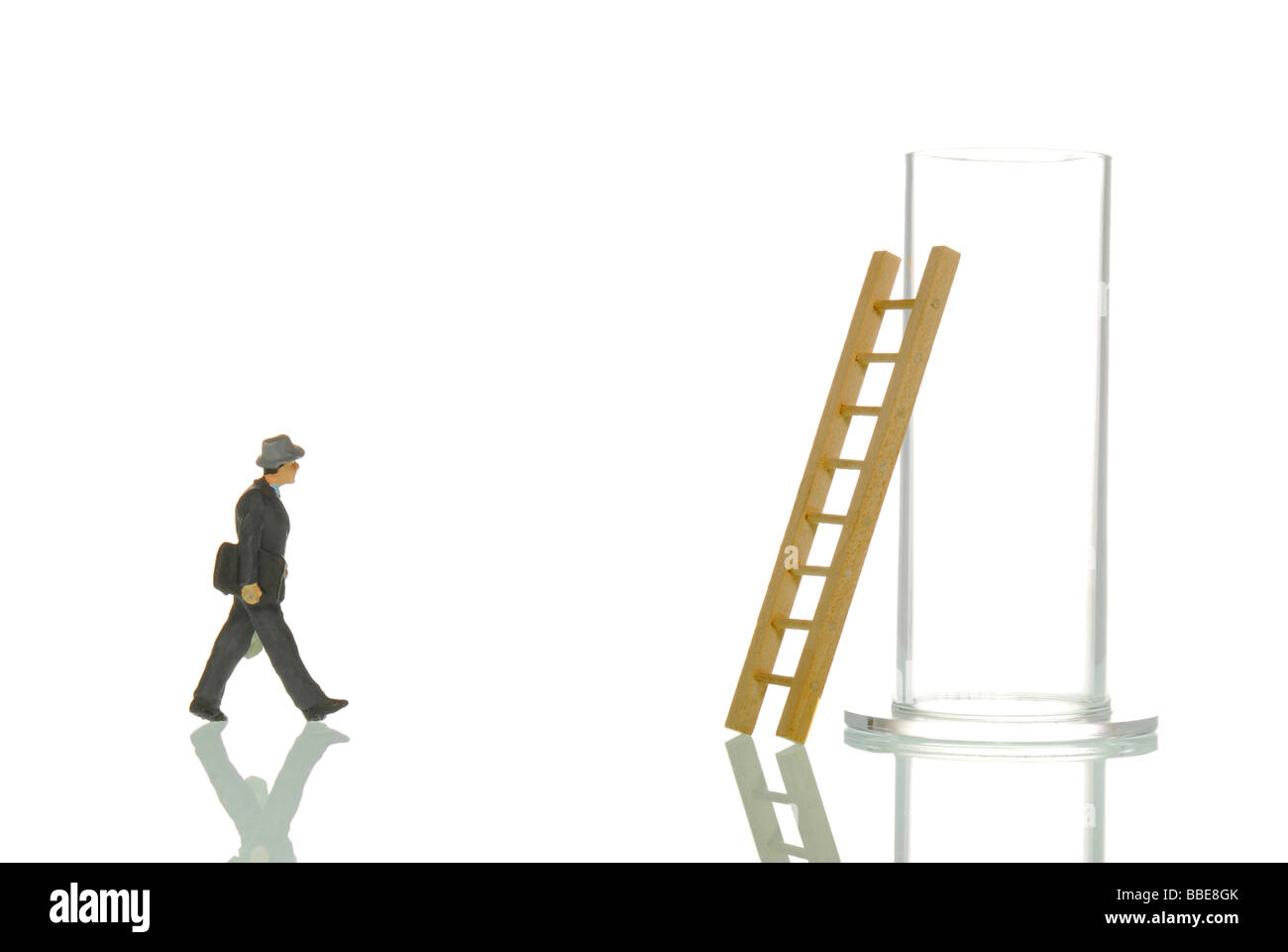 Manager figurines and glass with ladder, symbolic image for 'Back in the everyday' Stock Photo