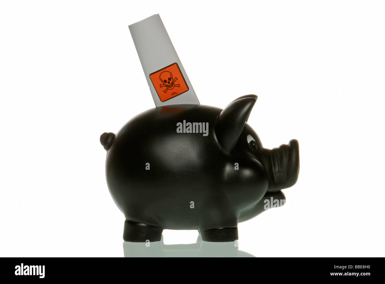 Piggy bank with toxic paper, symbolic image for Bad Banks Stock Photo