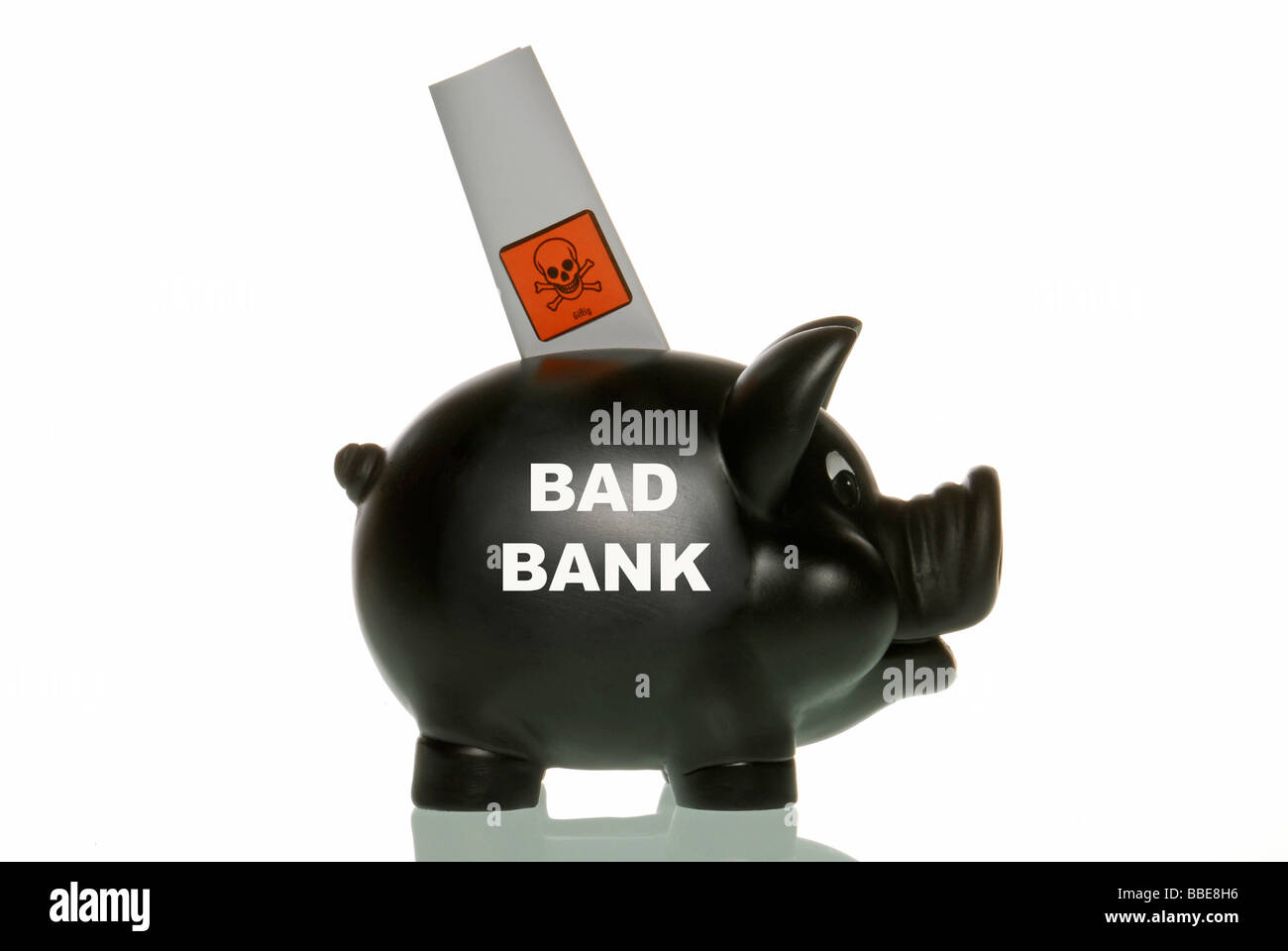 Piggy bank with toxic paper, symbolic image for Bad Banks Stock Photo