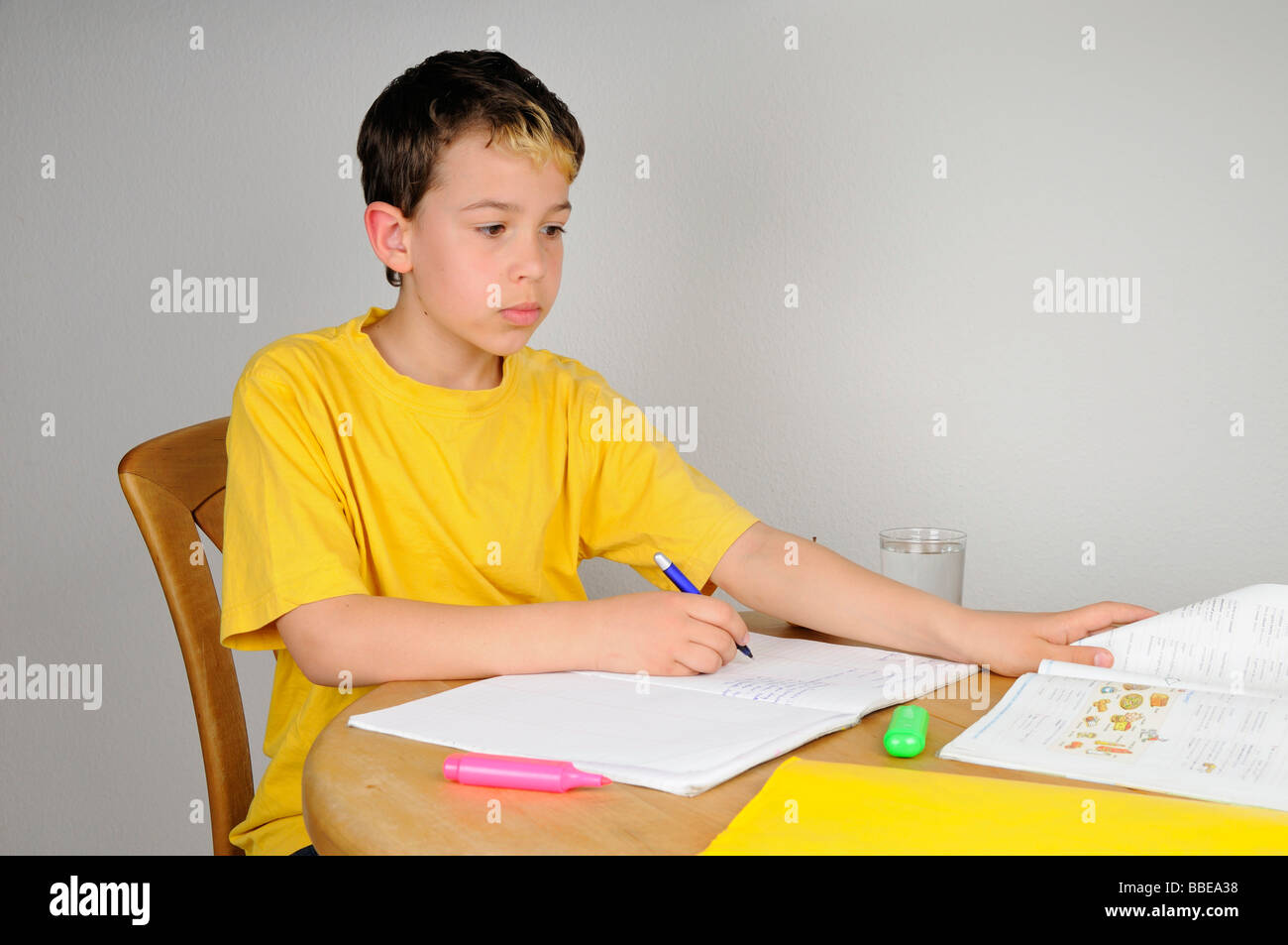 Boy doing homework for school Stock Photo