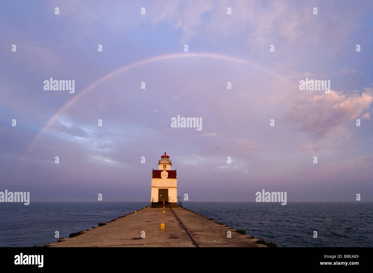 Rainbow over the Kewaunee Pierhead Lighthouse at Sunset Lake Michigan Algoma County Wisconsin Stock Photo