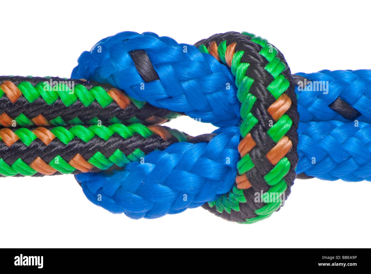 Two climbing ropes are entwinded, symbolic image for cohesion, strong hold Stock Photo