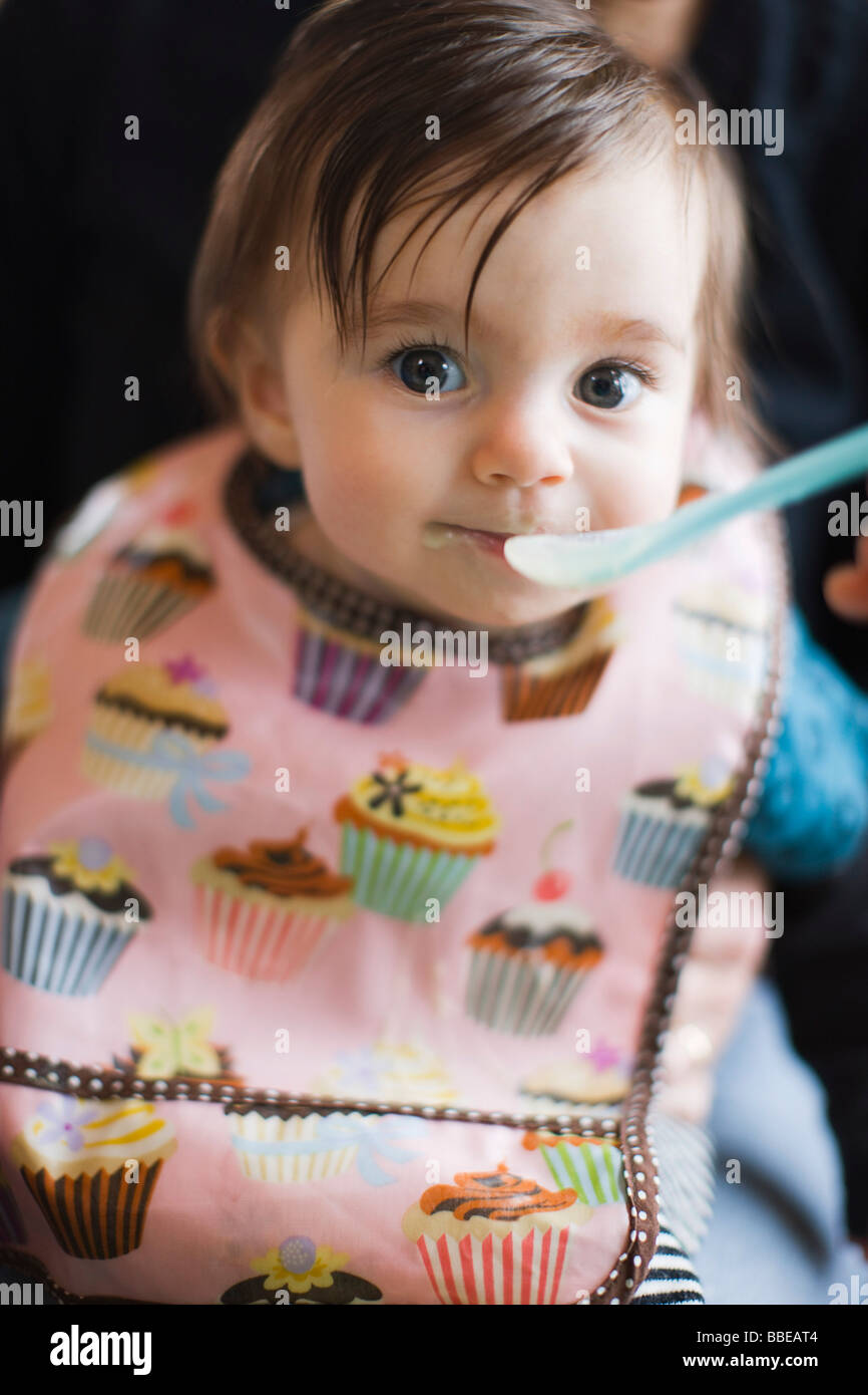 Baby Girl Tasting Solid Food For the First Time Stock Photo Alamy