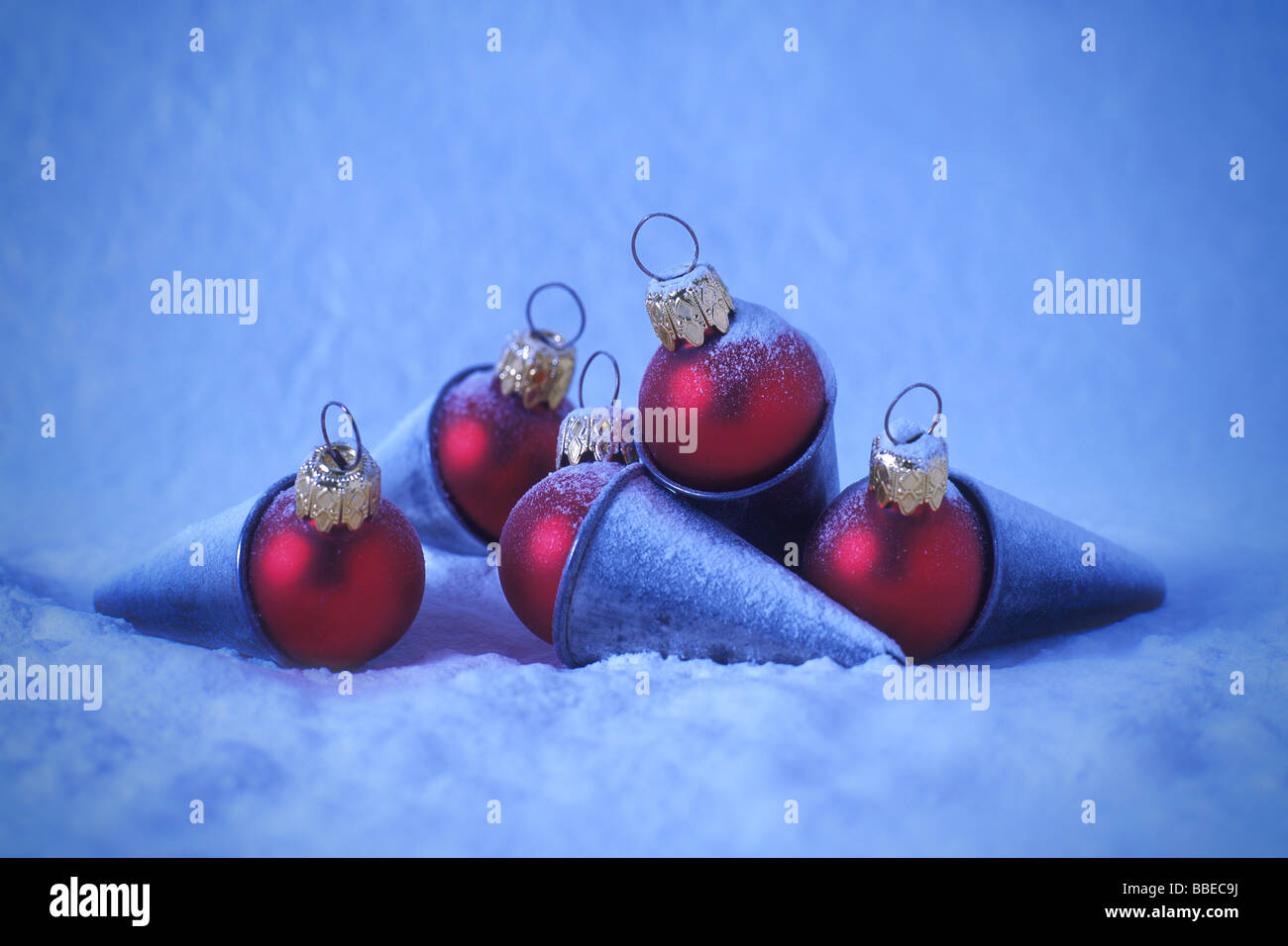 Red Christmas Ornaments Inside Antique Pastry Decorating Tips Stock Photo