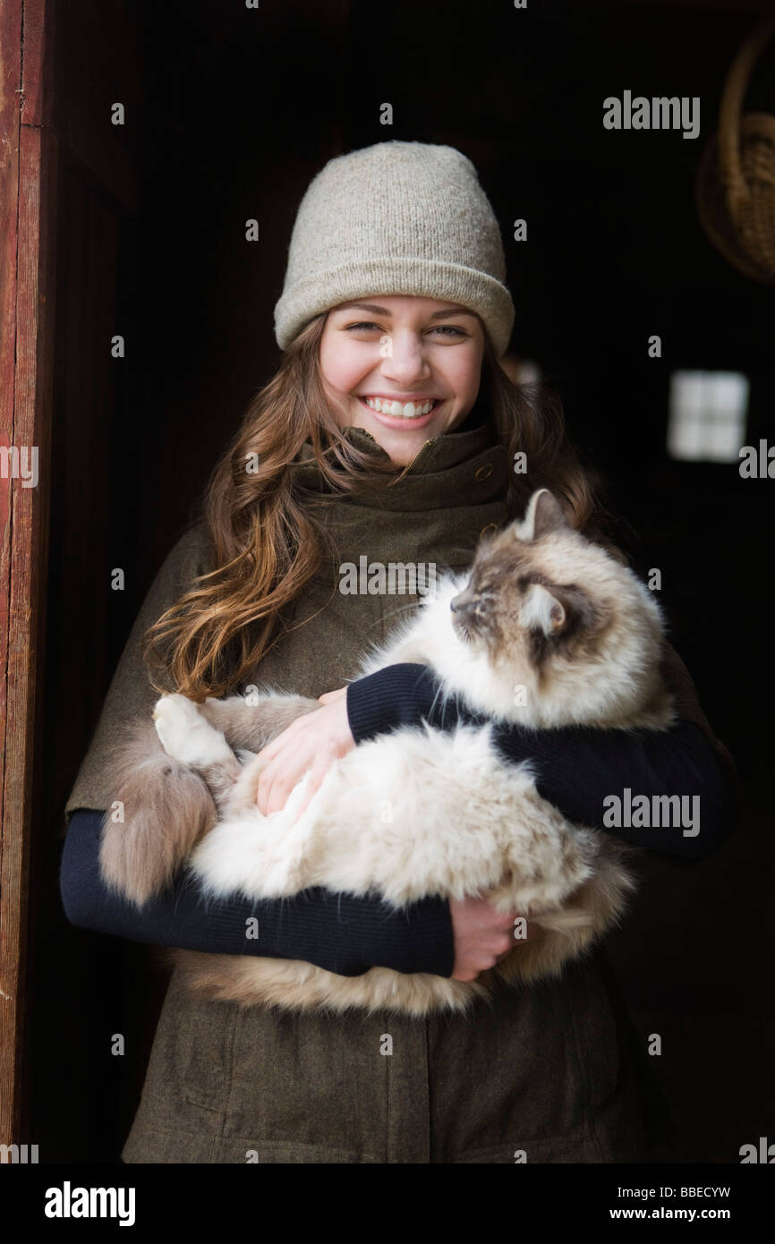 Portrait of a Teenage Girl Holding a Cat on a Farm in Hillsboro, Oregon
