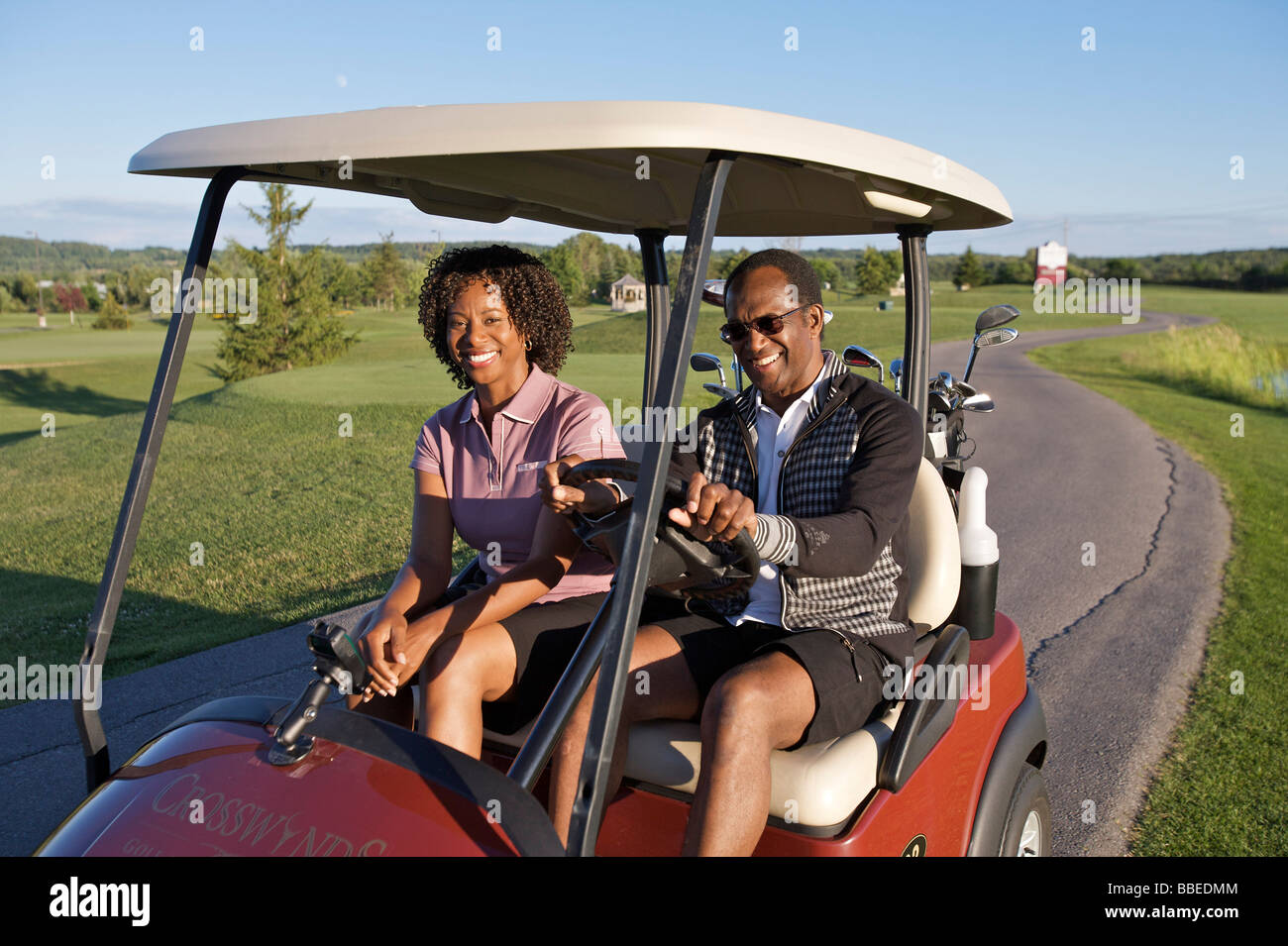 Couple in Golf Cart, Burlington, Ontario, Canada Stock Photo