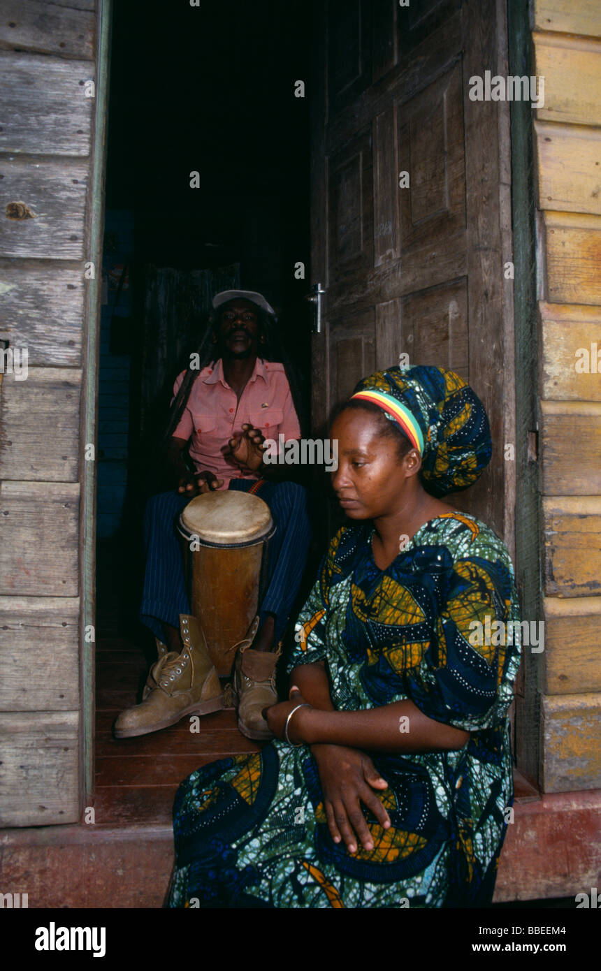 JAMAICA Music Percussion Rastafarian couple with man playing bongo