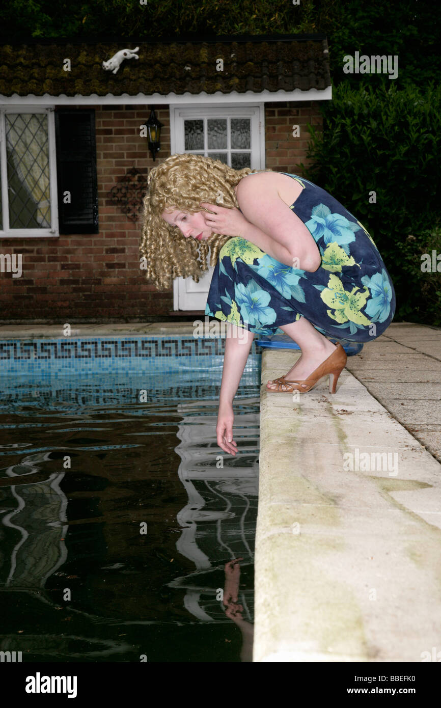 Woman at Edge of Dirty Swimming Pool Stock Photo Alamy