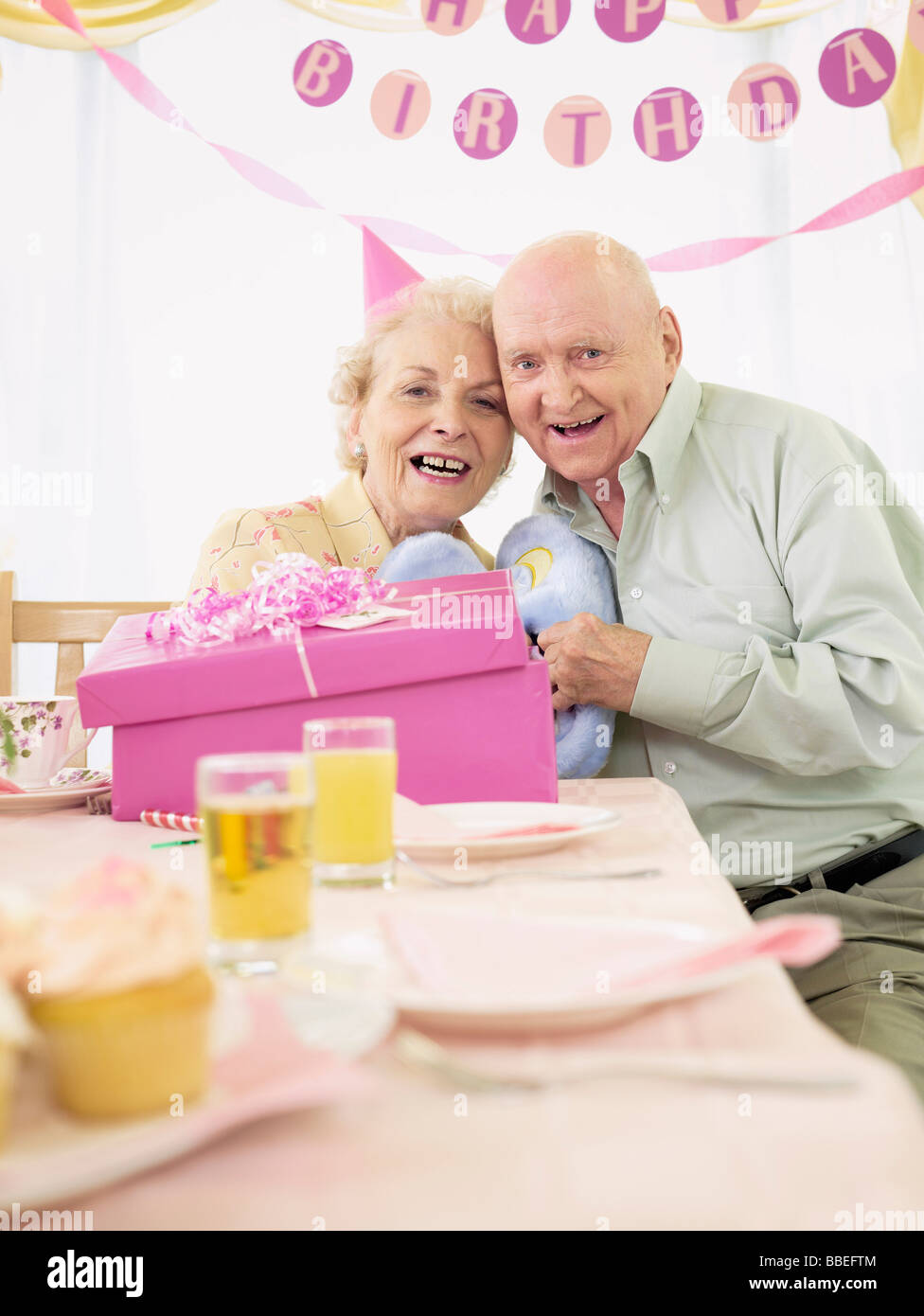 Portrait of Couple at Birthday Party in Retirement Home Stock Photo