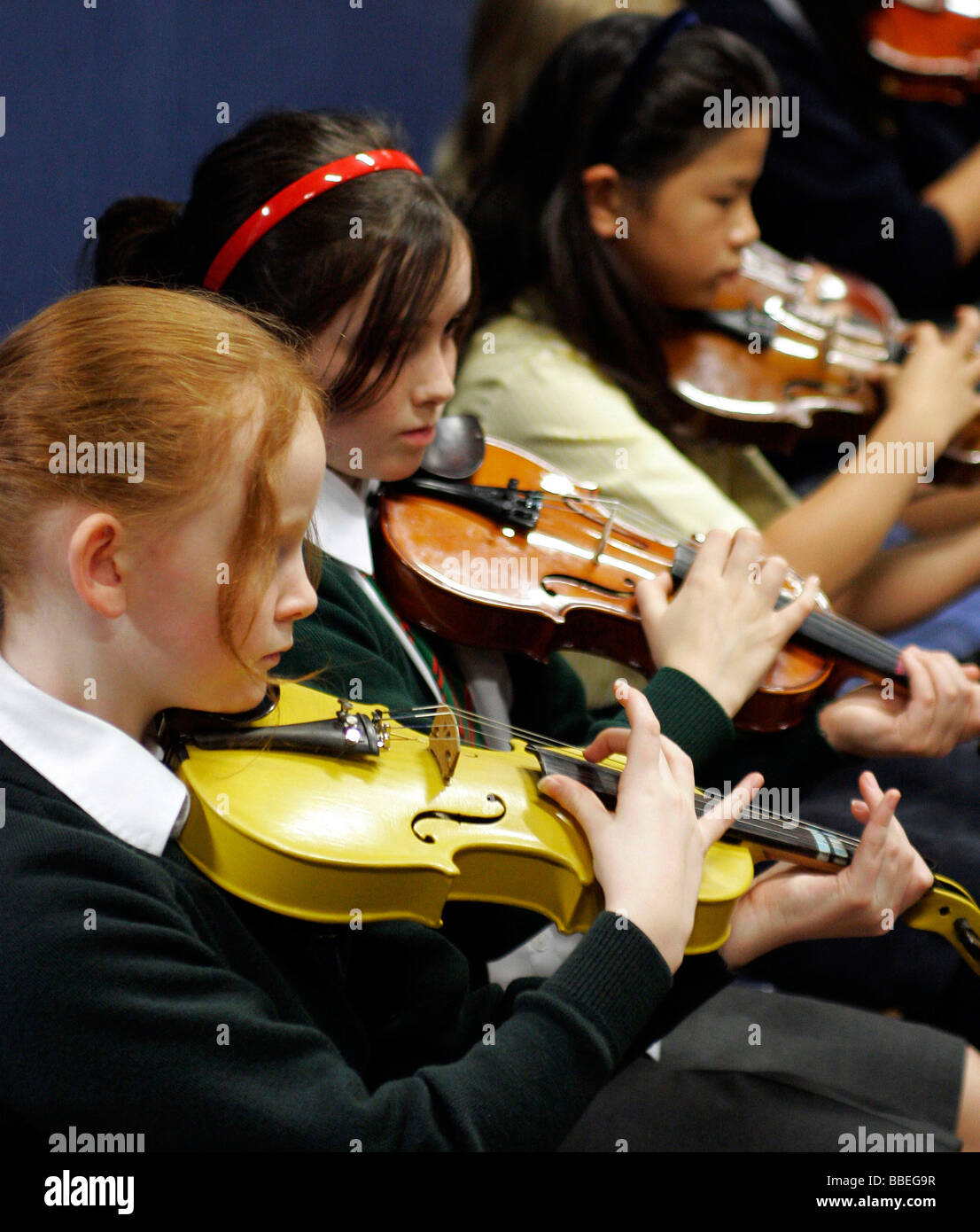 CHILDREN Education Music School orchestra girls playing violins