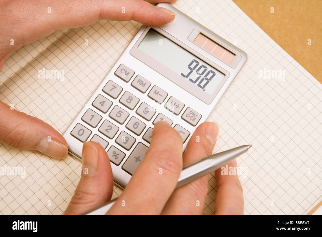 Hands Using Calculator Stock Photo Alamy