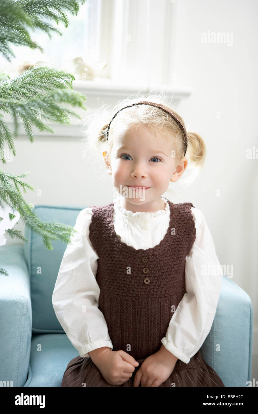 Portrait of Little Girl Sitting in Chair Stock Photo - Alamy