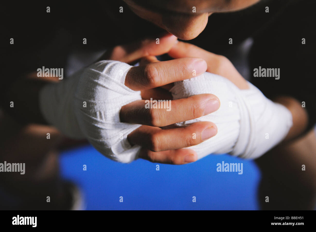 Boxer's hands and knuckles tied with bandage Stock Photo Alamy