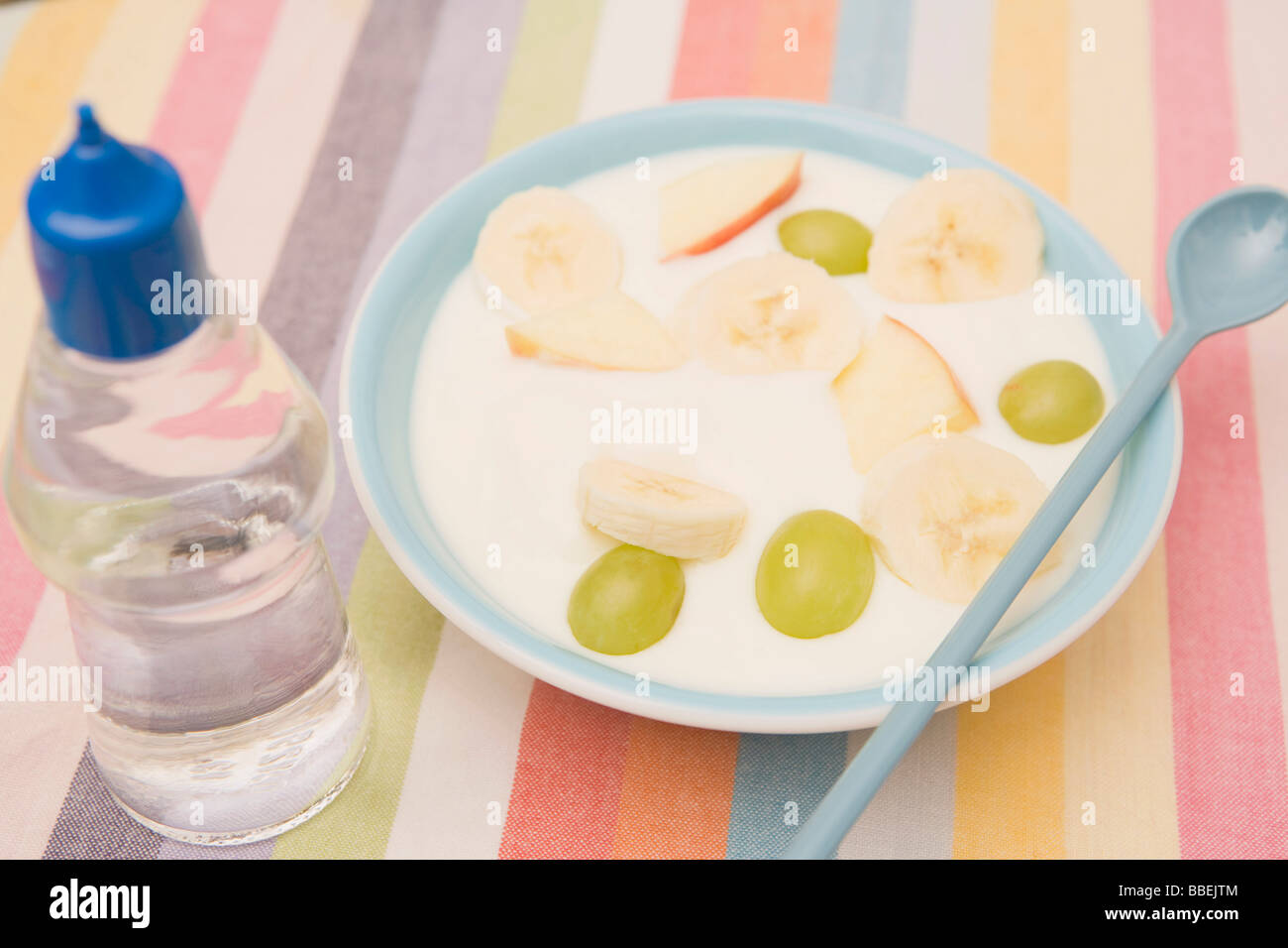 Bowl of Fruit and Yogurt and Bottle of Artifical Sweetener Stock Photo