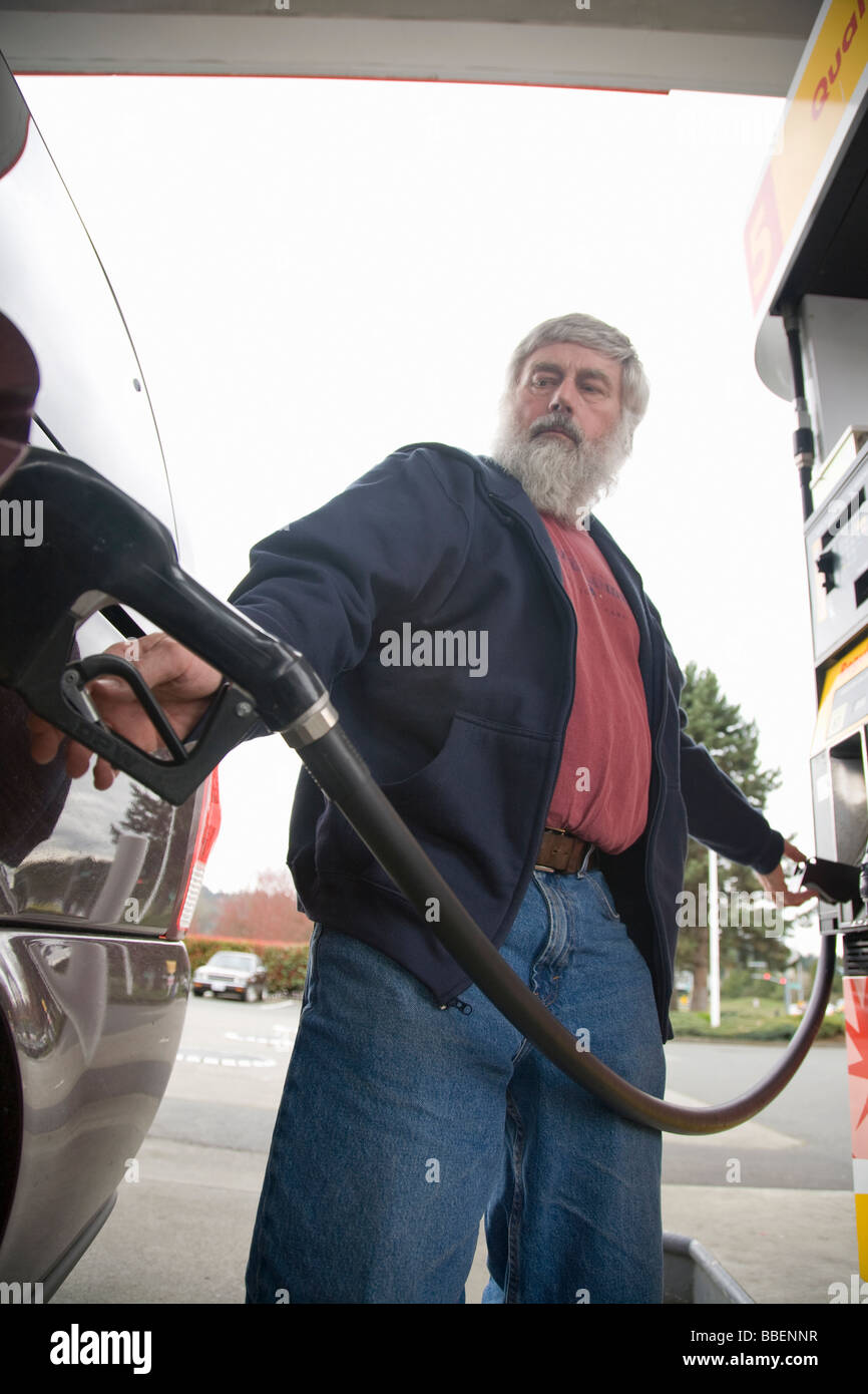Individual pumping fuel, Bellevue, Washington Stock Photo