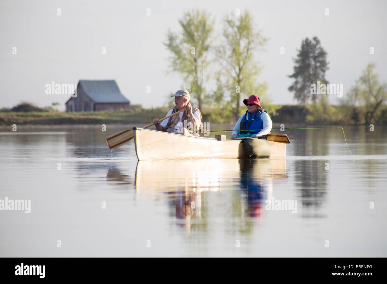 Elderly couple fly fishing in canoe, Amber Lake, Washington Stock Photo -  Alamy