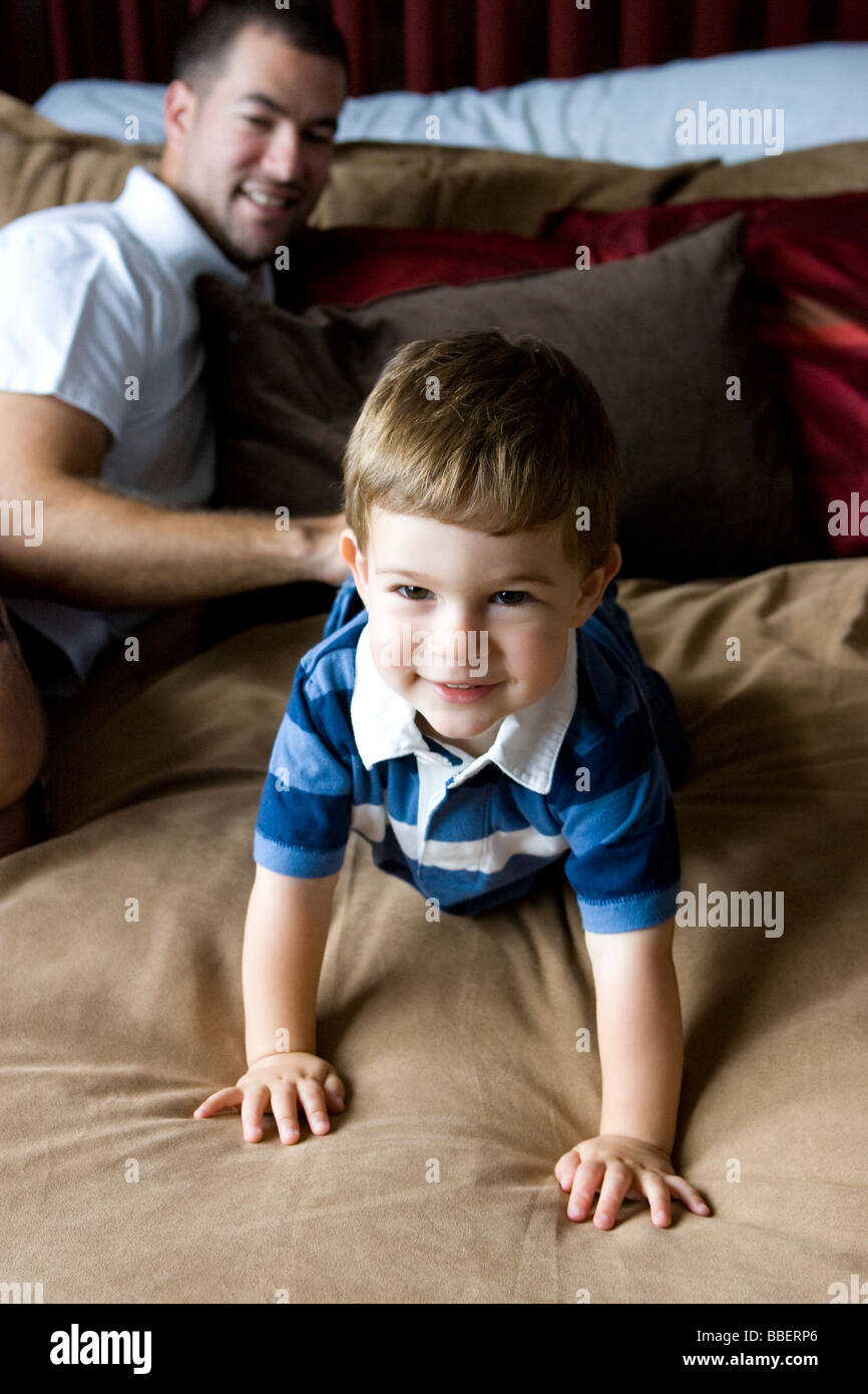 Man crawling camera on bed hires stock photography and images Alamy