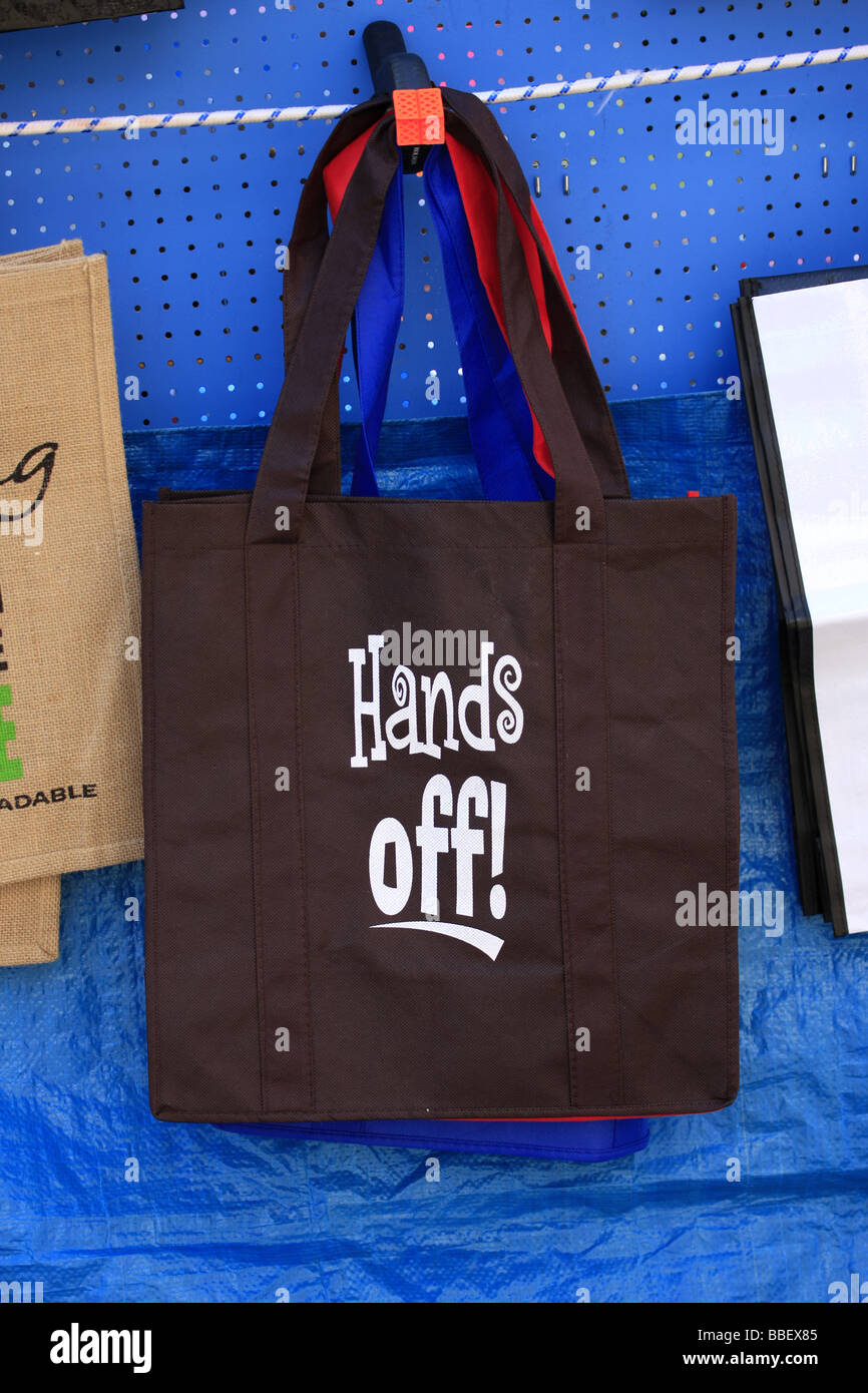 A shopping bag with the words Hands Off wriiten on it Stock Photo