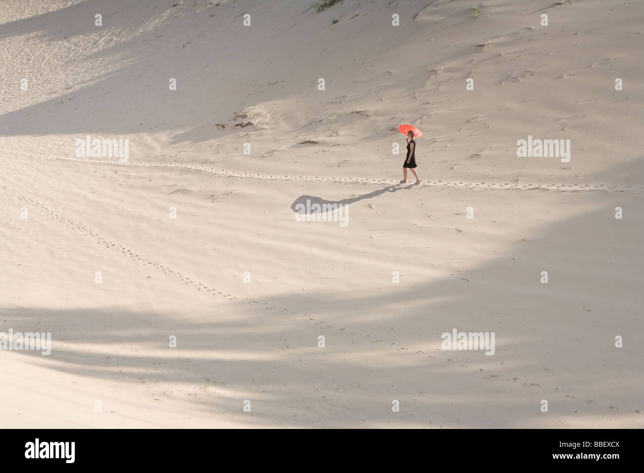 Woman walking beach alone dress hi-res stock photography and images - Alamy