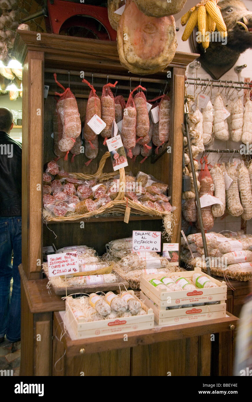 display of hanging salami and prosciutto in one of Italy's finest butchers Falorni macelleria in