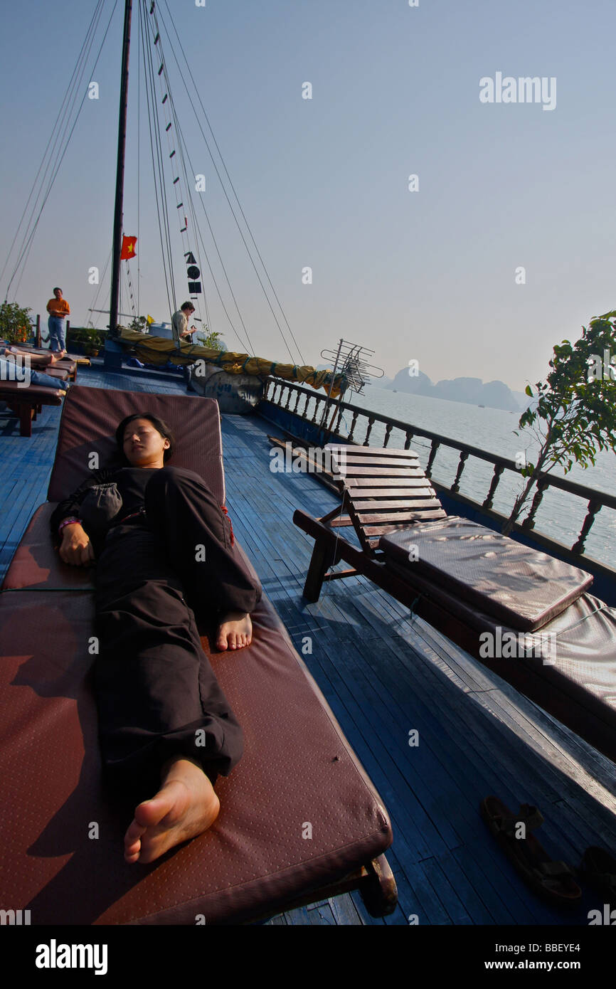 woman lie down on a boat in the halong bay Stock Photo
