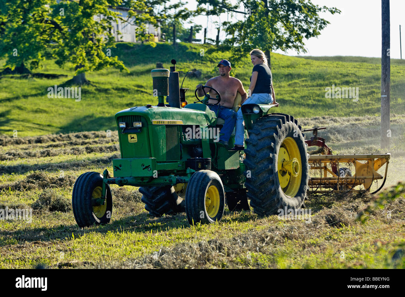 Farmer and his Wife on John Deere 3010 Diesel Tractor in Harrison County Indiana Stock Photo