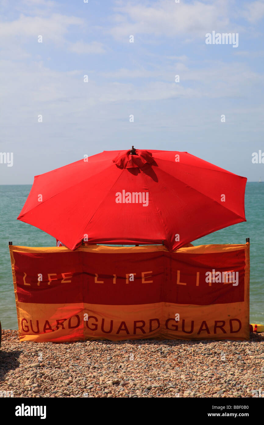 Life guard stand with parasol Seaford East Sussex UK Stock Photo