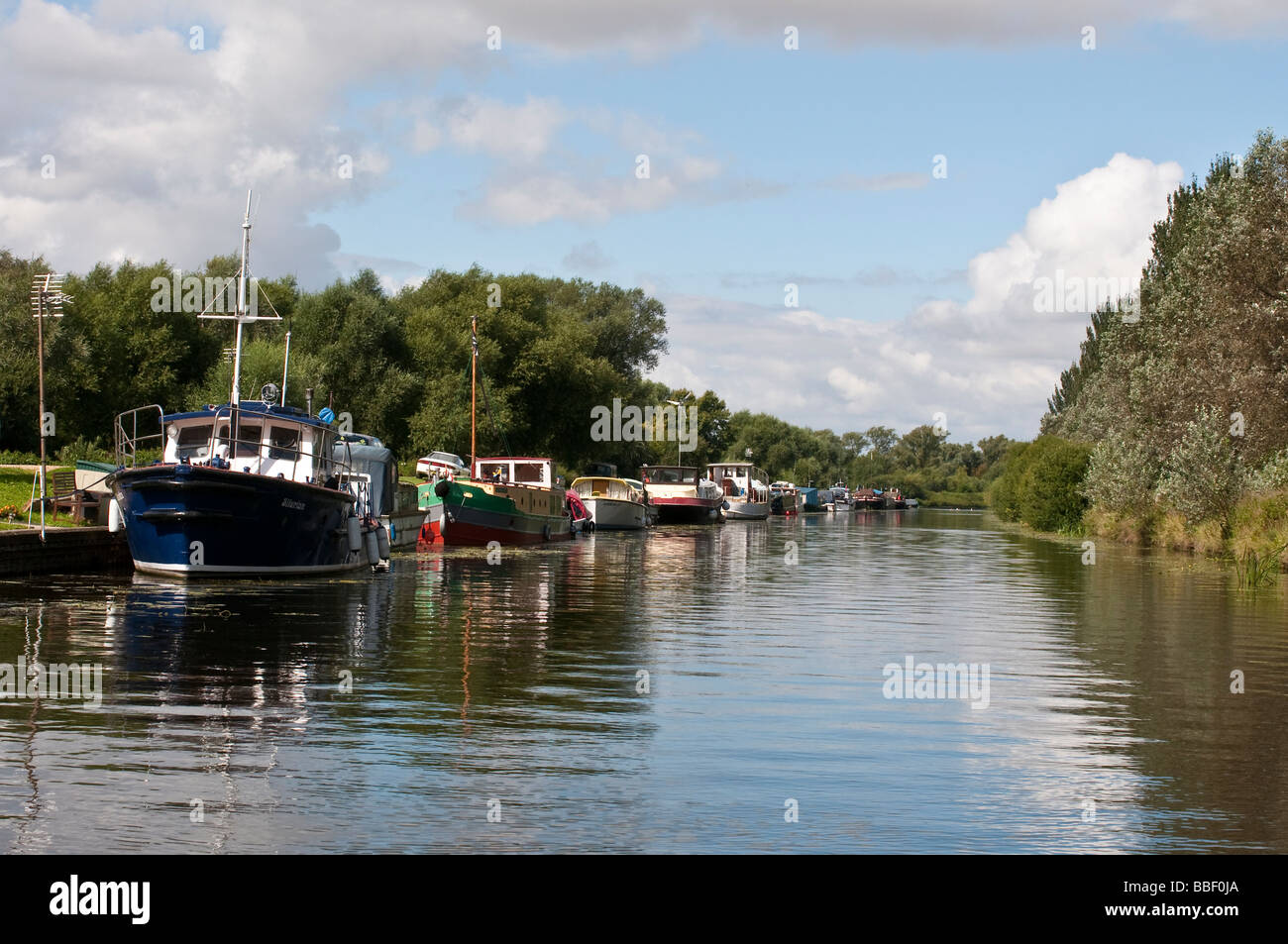 Boats Moored along the Fossdyke Canal on Sunny Summer's Day Stock Photo