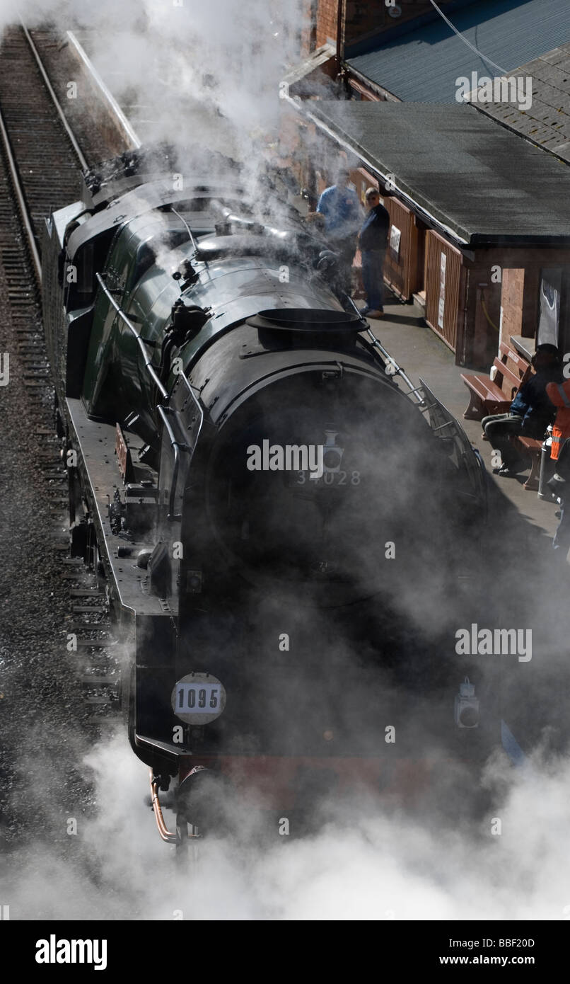 Steam engine letting off steam, West Somerset steam railway station, Bishops Lydeard, Somerset. Stock Photo