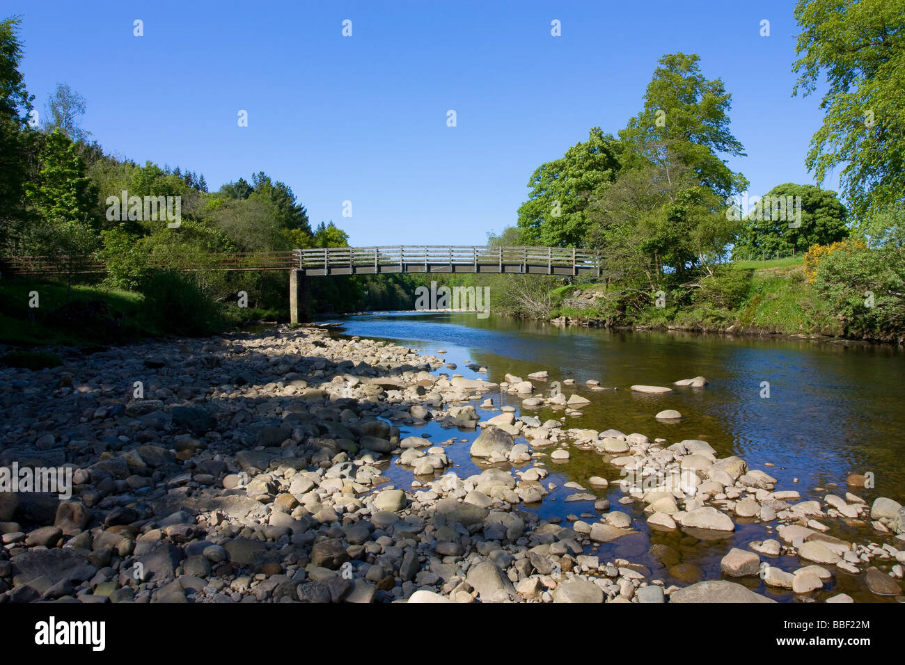 Landscape view of Wooden foot bridge over River South Tyne leading to
