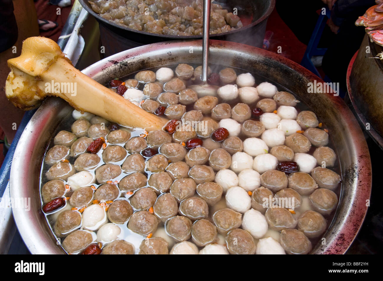 Chinese Stockpot or soup slowly cooking on a Street Food Vendors Stall