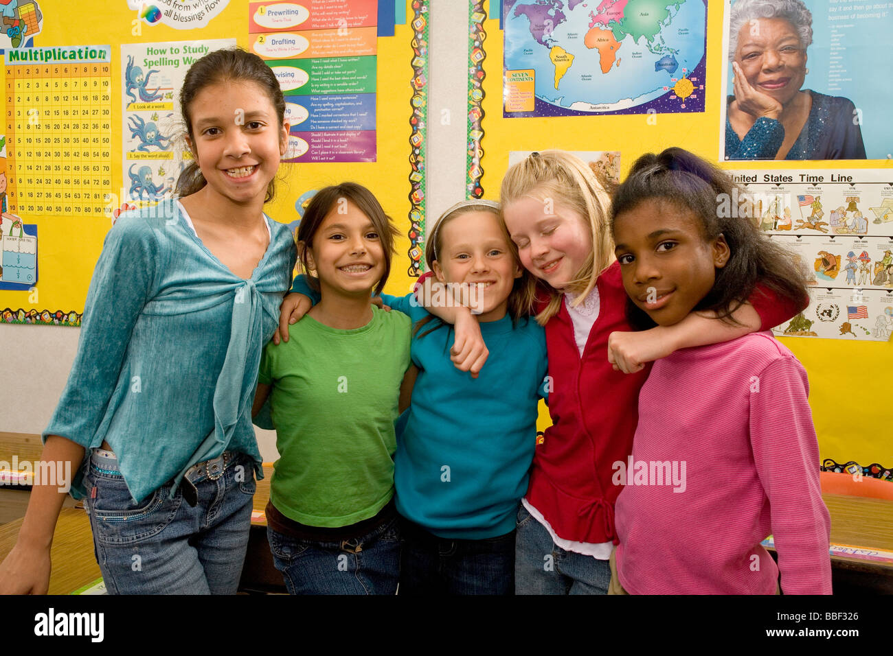 differing 3rd grade girls group 8-9 year old olds ethnic inter racial diversity racially diverse multicultural cultural interracial POV United States Stock Photo