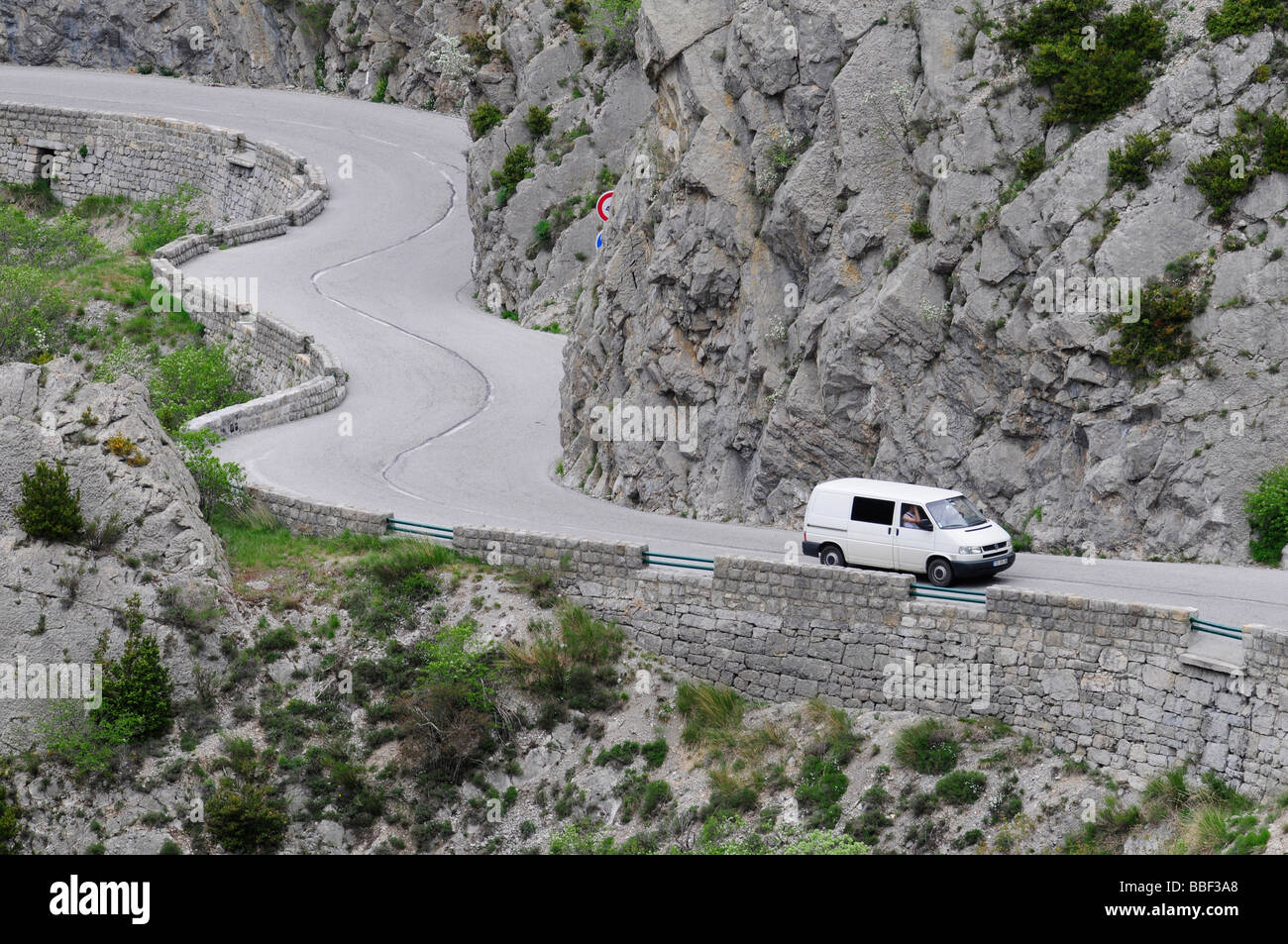 Driving a car on the famous 'route Napoleon', a winding scenic road in a canyon in southern France. Stock Photo