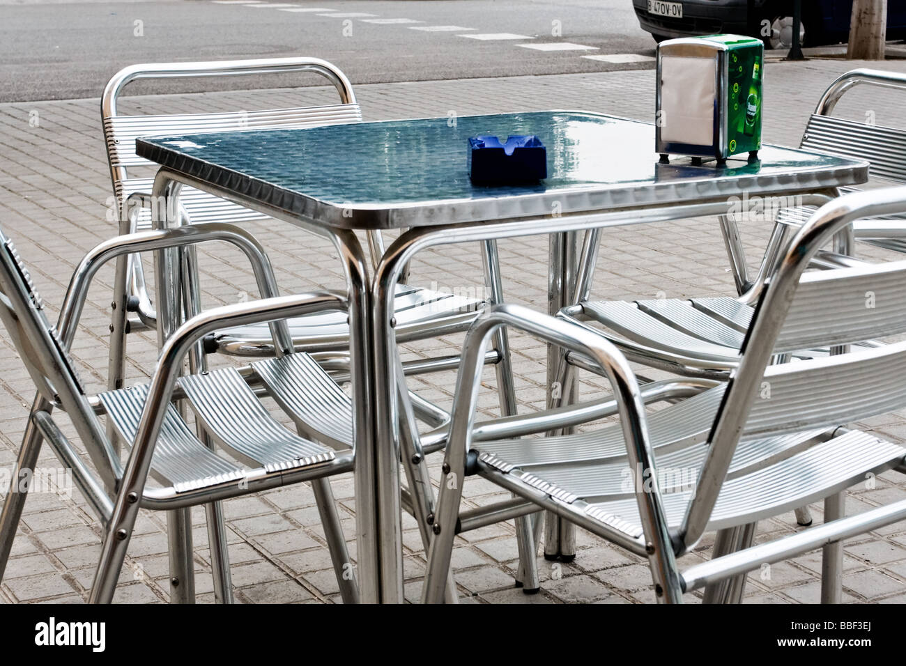 Metal table and four metal chairs, outside a cafe bar in Diagonal Mar