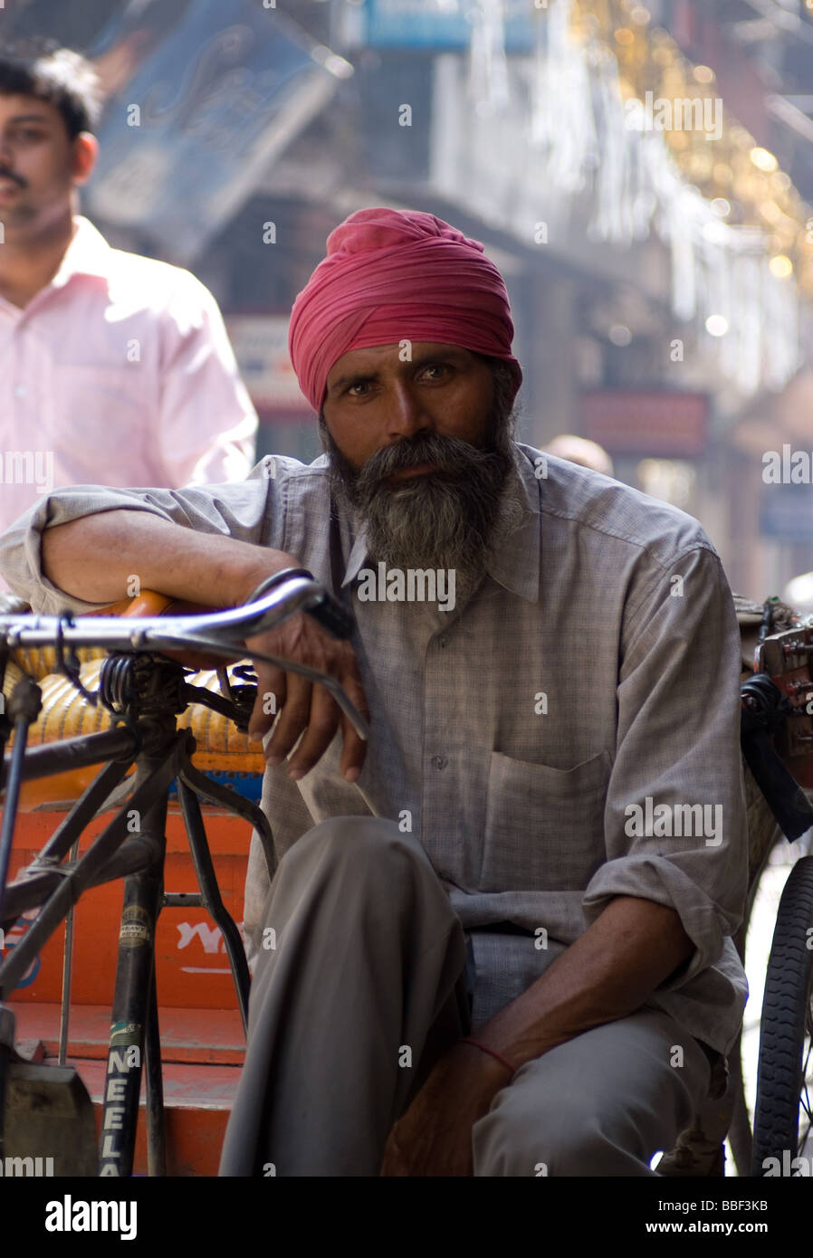 The Rickshaw Rider a rickshaw rider takes a rest Stock Photo - Alamy