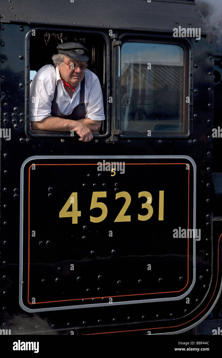 Steam train driver on the West Somerset Railway. Stock Photo