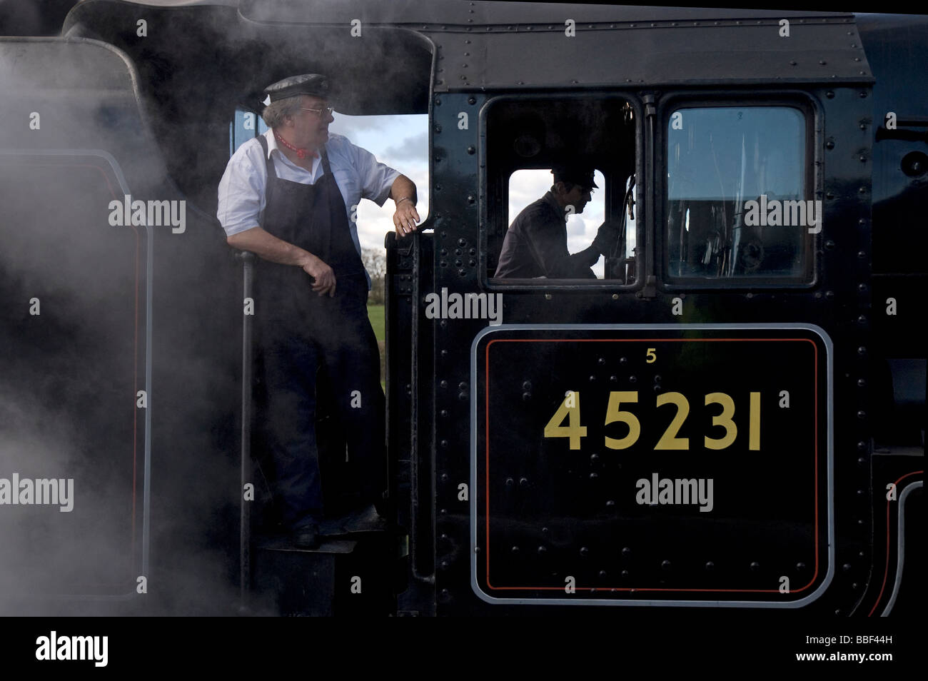Steam train driver on the West Somerset Railway. Stock Photo