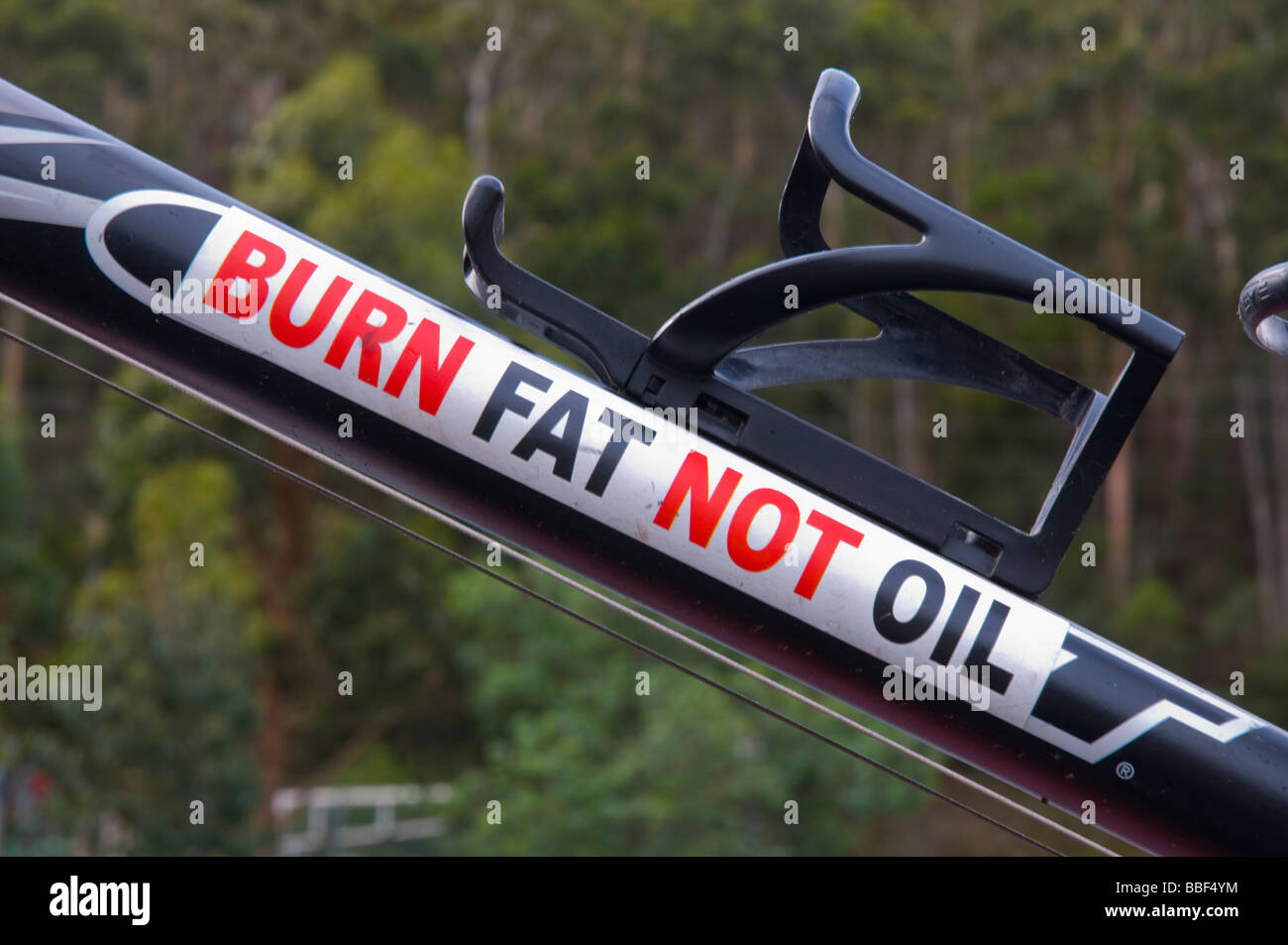 A pro cycling sticker advocating cycling over driving on the frame of a mountain bike Stock Photo