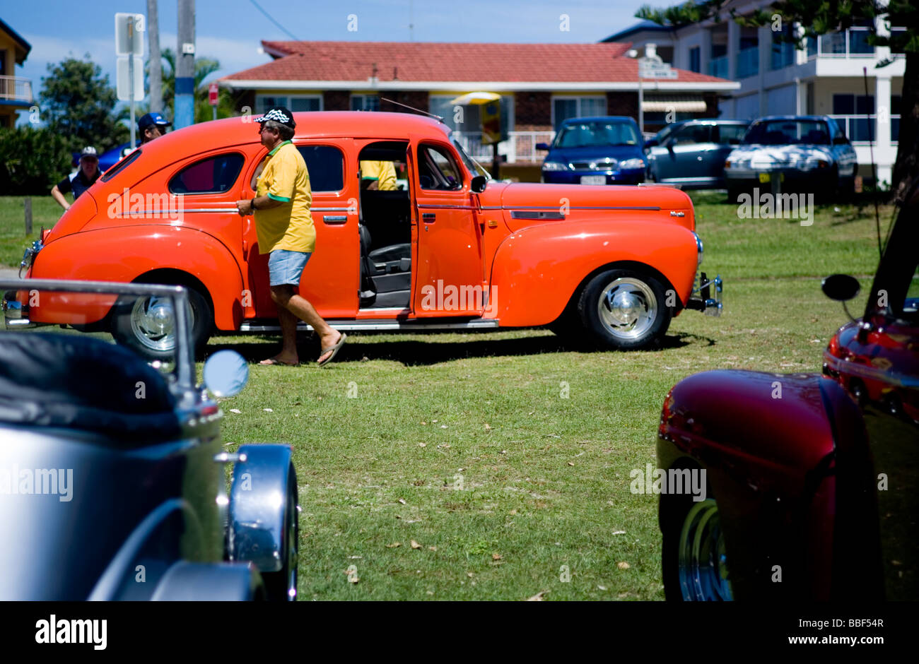 Vintage orange car and owner Stock Photo