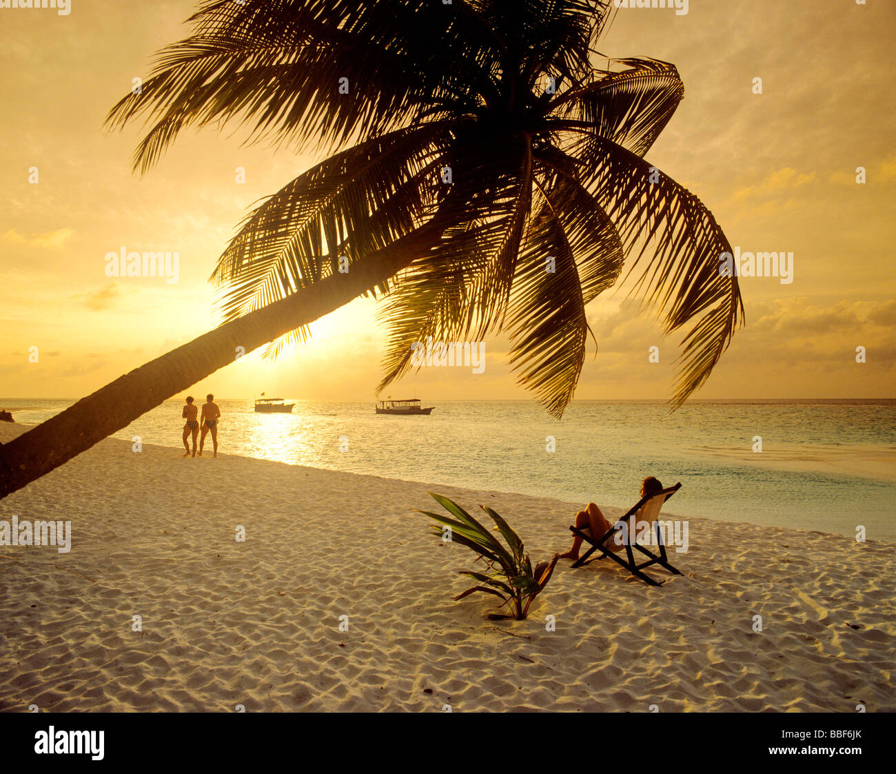 sunset at beach island of fihalhohi maldives Stock Photo