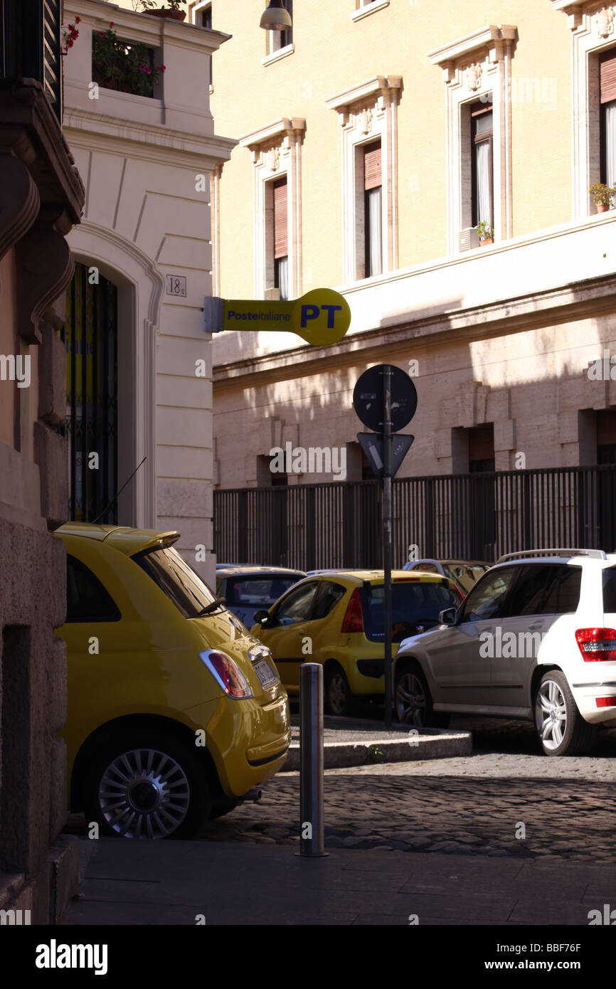 Yellow Fiat 500 parked in a street of Rome Stock Photo - Alamy