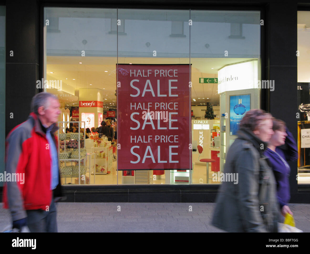 half price sale poster in Exeter shop window Stock Photo