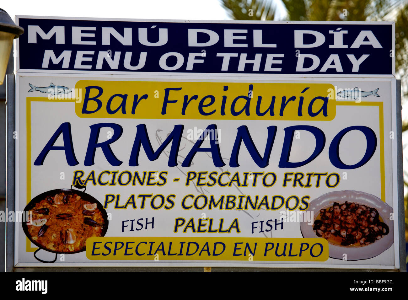 Bilingual menu board, sign in two languages (English and Spanish) above a restaurant in