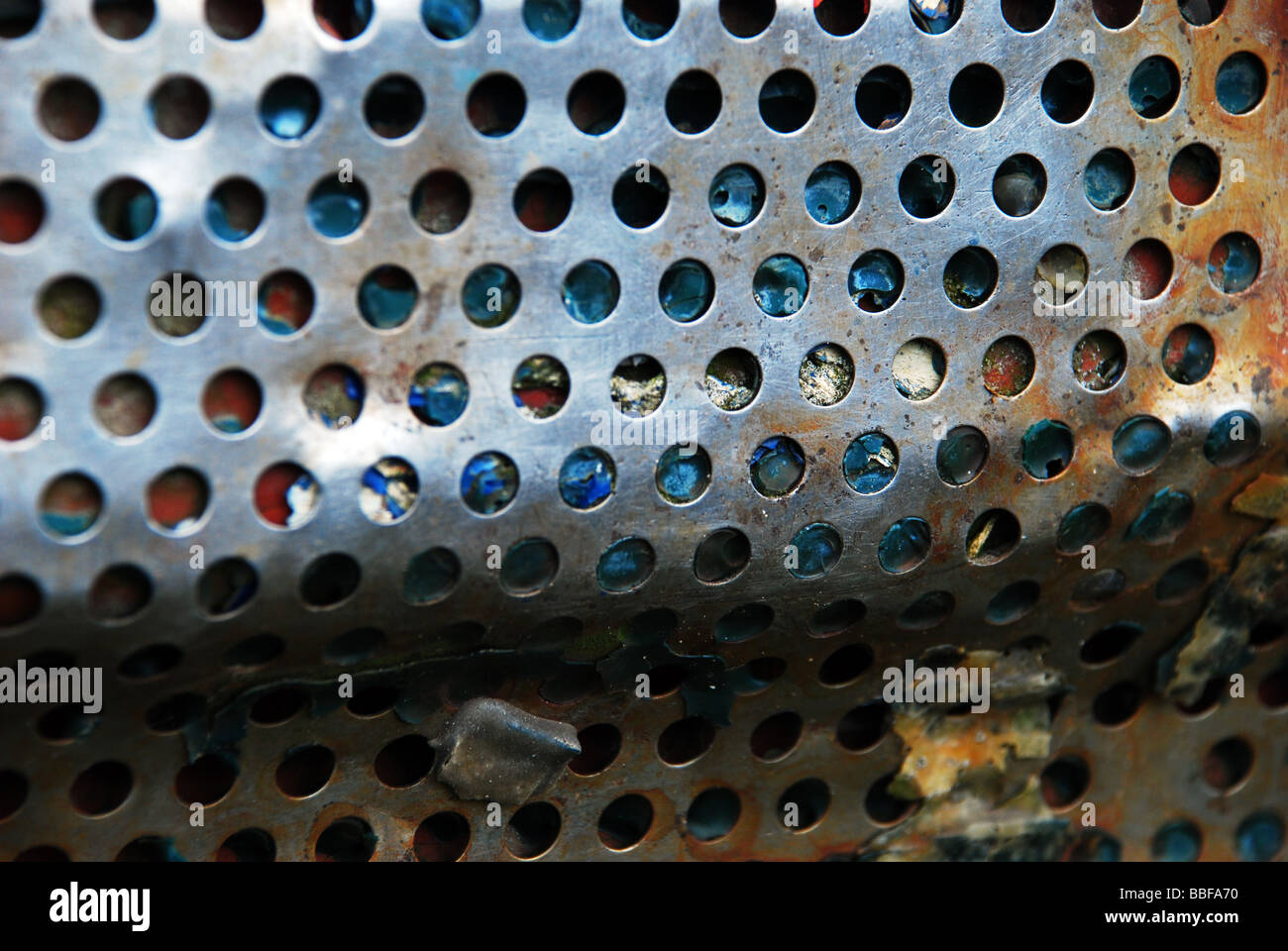 Steel grating, rusted and bent over wood Stock Photo