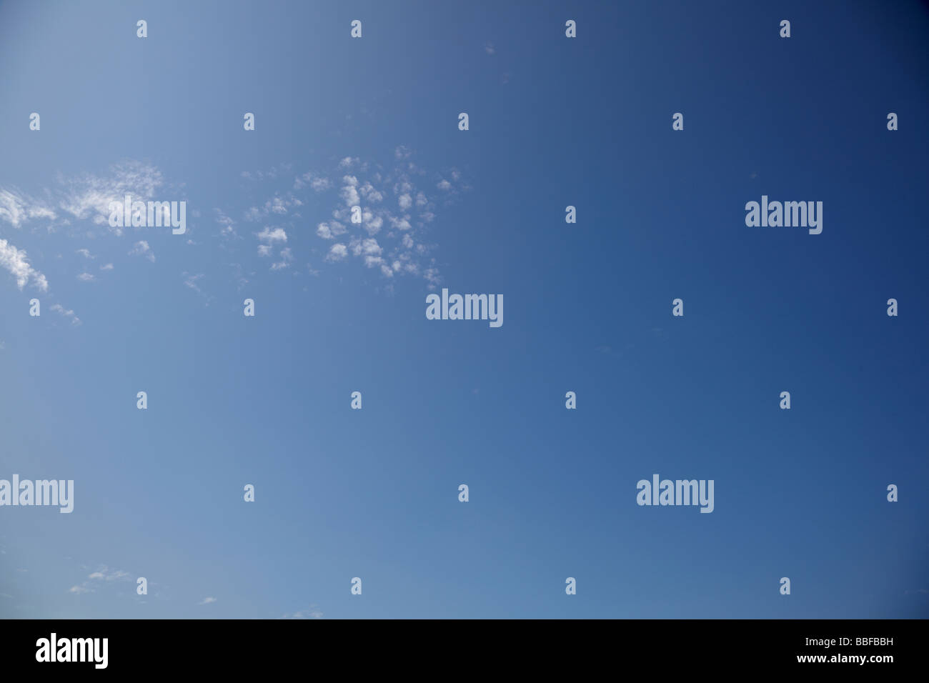 Blue sky with fluffy clouds Stock Photo - Alamy
