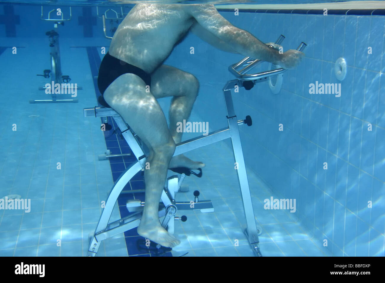 Underwater picture man exercising on a Bycicle Stock Photo